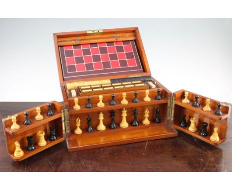 A late Victorian mahogany cased games compendium, by F.H. Ayres, with ebony and boxwood chess pieces, draught counters, cribb