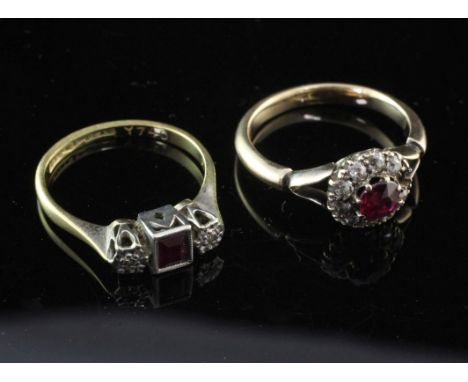 A 1920's gold, ruby and diamond cluster ring and a 1920's 18ct gold and platinum ruby and diamond three stone ring, the forme