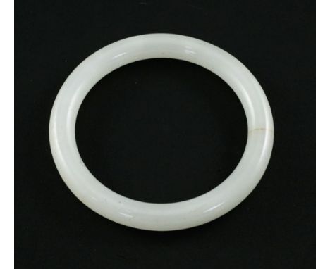 A Chinese white jadeite bangle, of good even tone, 9cm.