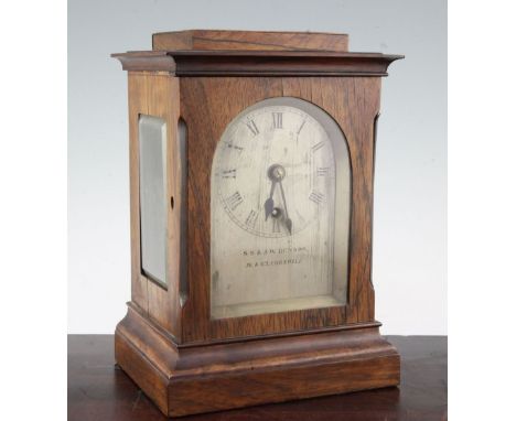 A Victorian rosewood mantel timepiece, in plain architectural case, with arched silvered dial signed S.S. and J.W. Benson, 16