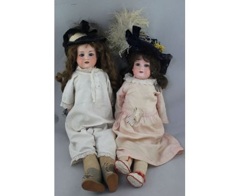 An Armand Marseille bisque headed doll, 370, with impressed marks AM and 3 DEP, with soft body and composition lower arms and