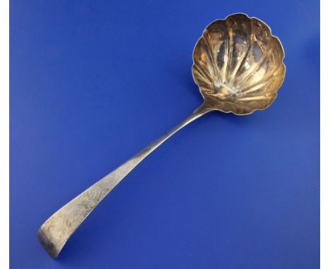 A late 18th/early 19th century Scottish provincial silver Old English pattern soup ladle, with engraved armorial, foliate scr