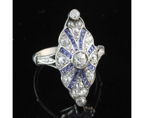 A 1930's Art Deco platinum, sapphire and diamond ring, of shaped marquise form, set with old cut diamonds, square cut sapphir