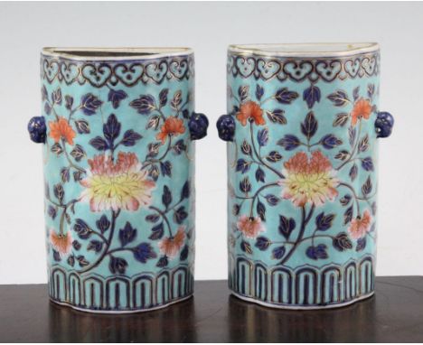 A pair of Chinese enamelled porcelain wall pockets, Qianlong period, painted in imitation of cloisonne enamel with peonies an