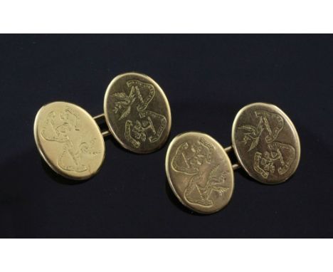 A pair of early 20th century 18ct gold oval cufflinks, each link engraved with two armorials, 14 grams.