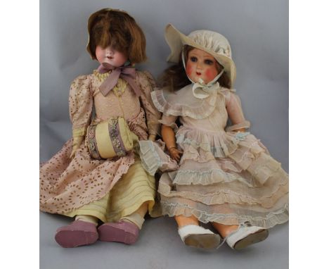 An Armand Marseille bisque headed doll, marked 246 Flora Dora, with sleeping eyes and jointed composition body, impressed mar