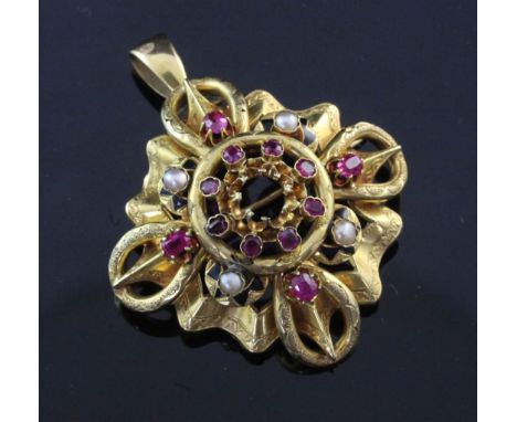 An early 20th century 18ct gold, ruby, split pearl and black enamel pendant brooch, of pierced quatrefoil design, lacking cen