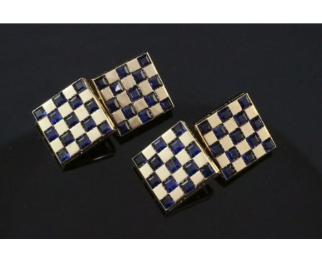 A pair of gold and sapphire set "chequered" cufflinks, of square form, each set with thirteen square cut sapphires, 0.5in.