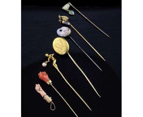 Six assorted 19th/early 20th century stick pins, including French 18ct gold acorn, gold nude lady with pearl drop and a mourn