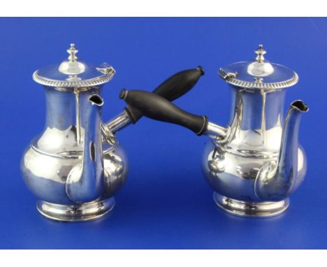 A pair of George V silver cafe au lait pots by William Hutton & Sons Ltd, of baluster form, with turned wooden handles, Sheff