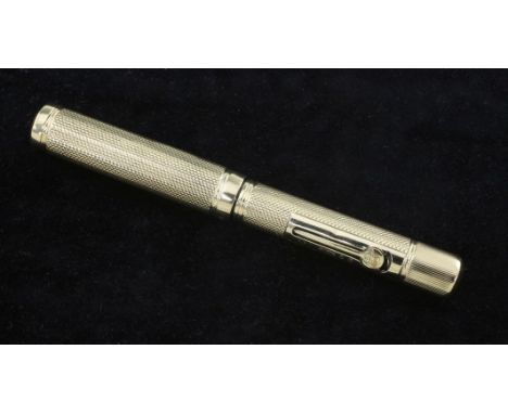 A small 9ct gold Waterman's Ideal fountain pen, with engine turned decoration, 3.75in.