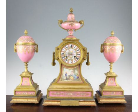 A 19th century French ormolu and Sevres style porcelain clock garniture, the architectural mantel clock with urn surmount, po