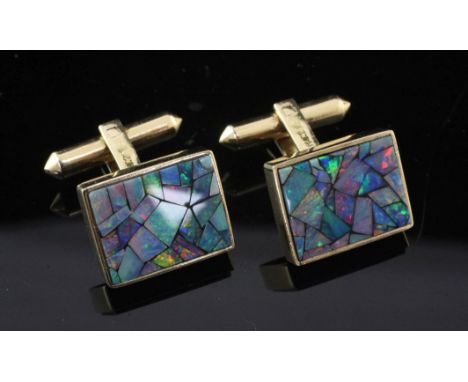 A pair of 18k gold and opal doublet cufflinks, of rectangular form, each set with opal segments, gross 11 grams.