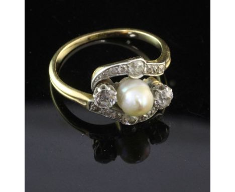 An early 20th century gold, cultured pearl and diamond ring, of scrolling design, set with single pearl and old mine cut diam