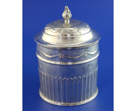 An Edwardian silver biscuit box by William Hutton & Sons Ltd, of cylindrical form, with hinged lid, engraved monogram and emb