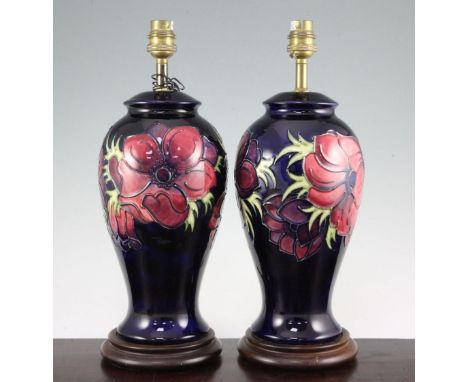 A pair of Moorcroft Anemone pattern lamp bases, late 20th century, each of baluster form with cobalt blue grounds, wood mount