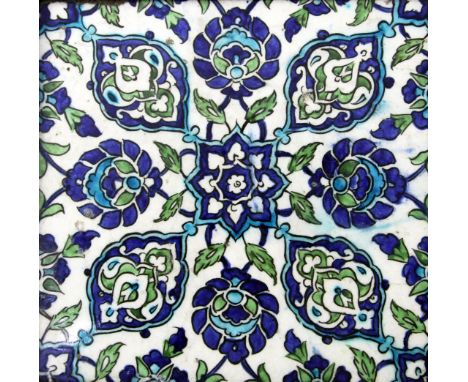 A Damascus pottery tile, Ottoman Syria, c.1600, the white ground decorated in cobalt blue, green and turquoise with a central