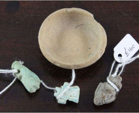 Three Egyptian faience amulets, modelled as a heart, c.700-300 B.C., a Wedjat Eye of Horus and The White Crown of Upper Egypt