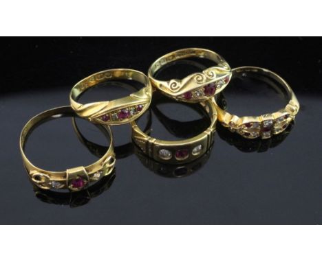 Five late Victorian/Edwardian 18ct gold, ruby and diamond set rings, various sizes.