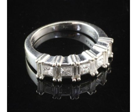 An 18ct white gold and diamond half hoop ring, set with five princess and five baguette cut stones with a total diamond weigh