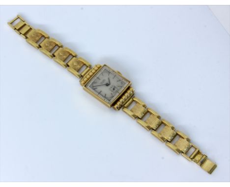 EBEL ARMBANDUHR.Gehäuse 750/000 Gelbgold, Armband Doublé (Amerikaner). Werk mit Handaufzug, bezeichnet EBEL. Versilbertes Zif