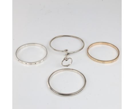 A group of Danish silver bracelets, bangles and a ring, including marine ivory example, ring size S, 61.3g total (5)

All in 