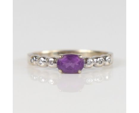 TORBEN GULDBRANDSEN MADSEN - a Danish modernist amethyst and diamond ring, 14ct  white gold settings, set with oval mix-cut a