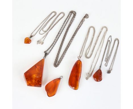 5 Danish Baltic amber pendant necklaces, on silver chains, largest pendant height 54.4mm, 36.5g total (5)

Generally good ori