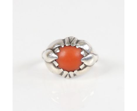 GEORG JENSEN - a Vintage Danish modernist coral ring, stylised sterling silver set with central cabochon red coral, model no.