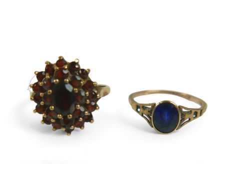 Two 9ct gold ladies dress rings, comprising an Art & Craft style sapphire ring, the stone approximately 6.7mm at widest point