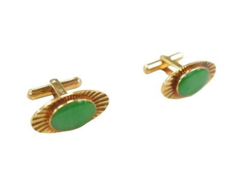 A pair of 14ct gold and jade style stone inlaid cufflinks, with gilt metal hinged bars, 11.7g gross, cased. 