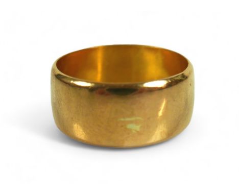 A 22ct yellow gold wedding band, band width 7.7mm, size J/K, 4.5g. 