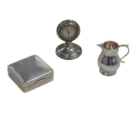 Three pieces of George V silver, comprising a silver cased travel clock with silvered Arabic dial, Charles Perry & Co. Cheste