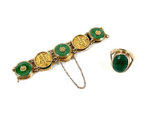 A Chinese 18ct yellow gold and jade set bracelet, formed of circular panels decorated with Chinese characters, alternating wi