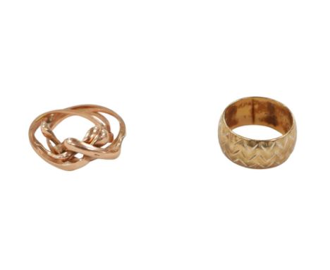 A yellow metal Russian ring, with indistinct marking, together with a 9ct band, both size J, 8.5g overall. (2) 