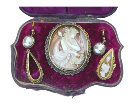 A demi-parure of Victorian gold and yellow metal mounted cameo jewellery, comprising a 9ct gold cameo ring, size H, 4.7g gros