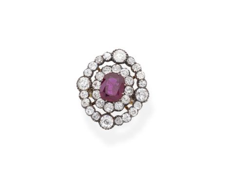 RUBY AND DIAMOND CLUSTER RINGThe central cushion-shaped ruby within an openwork surround of old brilliant and cushion-shaped 