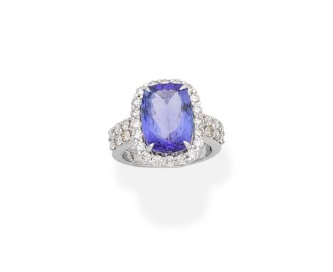 TANZANITE AND DIAMOND CLUSTER RINGThe rectangular-shaped tanzanite within a brilliant-cut diamond surround, to similarly-cut 