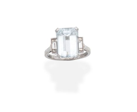 AQUAMARINE AND DIAMOND RINGThe step-cut aquamarine between baguette-cut diamond shoulders,  diamonds approx. 0.35ct, ring siz