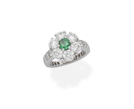 GRAFF: EMERALD AND DIAMOND CLUSTER RINGSet with a central circular-cut emerald, weighing 0.53 carat, within a surround of bri