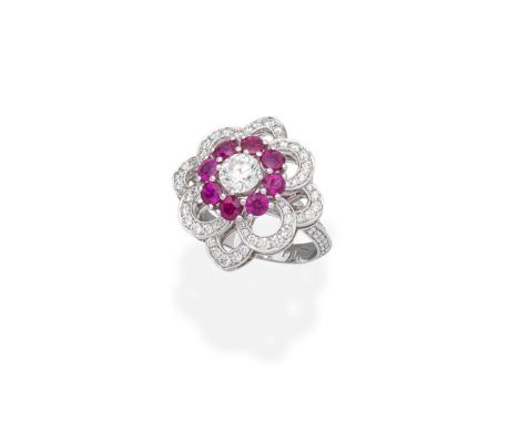 GRAFF: RUBY AND DIAMOND 'ROSETTE' RINGThe brilliant-cut diamond and circular-cut ruby cluster within an openwork floral surro