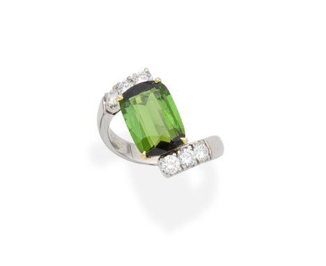 TOURMALINE AND DIAMOND RINGThe rectangular cushion-shaped tourmaline obliquely set between brilliant-cut diamond shoulders, d