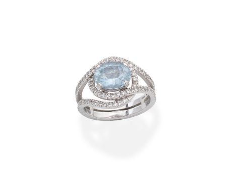 BOODLES: AQUAMARINE AND DIAMOND CLUSTER RINGThe central oval-cut aquamarine within an overlapping openwork surround set with 