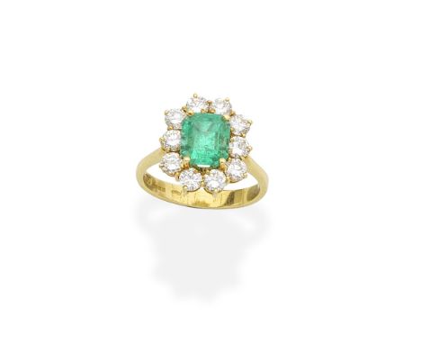 EMERALD AND DIAMOND CLUSTER RINGSet with an octagonal step-cut emerald, within a surround of brilliant-cut diamonds, mounted 