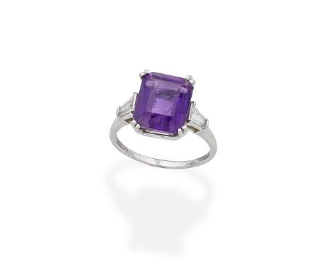 AMETHYST AND DIAMOND RING, 1997Set with a step-cut amethyst, between tapered baguette-cut diamond shoulders, mounted in plati