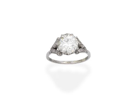 DIAMOND SINGLE-STONE RINGSet with an old brilliant-cut diamond, weighing 2.50 carats, between bifurcated single-cut diamond s