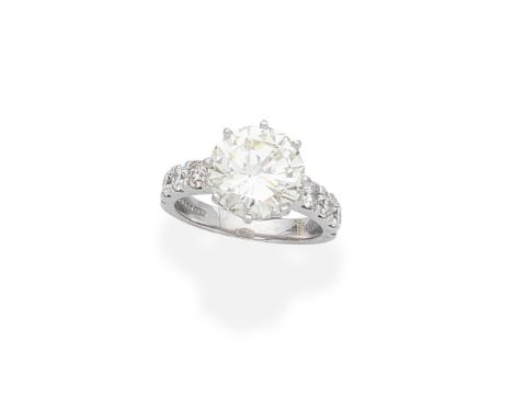 DIAMOND SINGLE-STONE RINGSet with a brilliant-cut diamond, weighing 3.75 carats, between similarly-cut diamond shoulders, rem