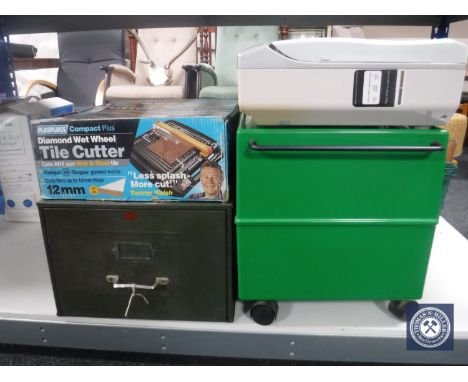 A plastic portable storage box together with a boxed tile cutter, vintage veteran series filing drawer together with an air c