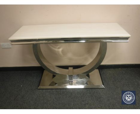 A contemporary polished steel console table with white polished stone top, width 122 cm 