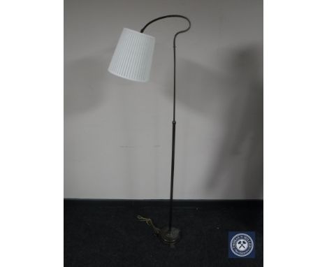 A 20th century brass adjustable standard lamp and shade 